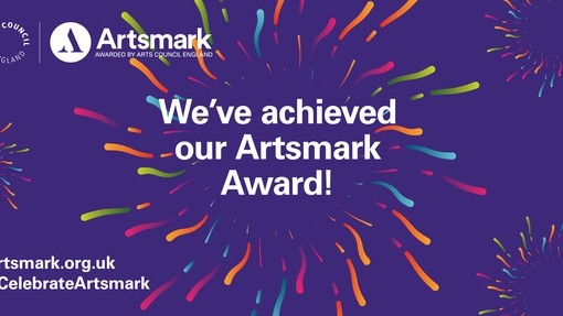 A purple backdrop with exploding lines around the words 'We've achieved our Artsmark Award'